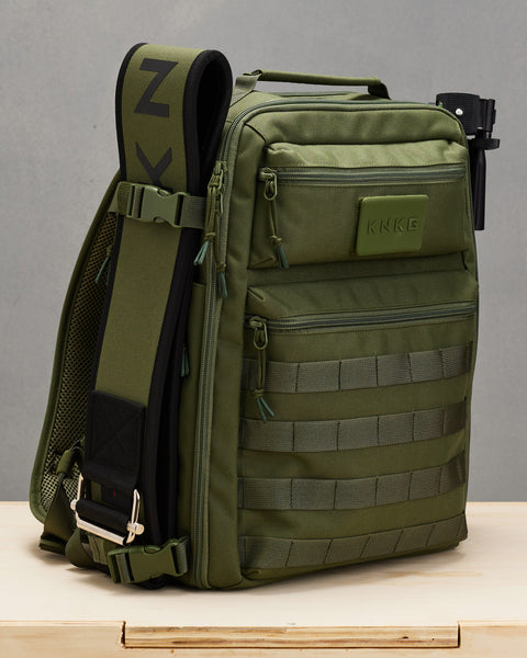 Green lifting belt attached to side of small green KNKG CONQUER Backpack
