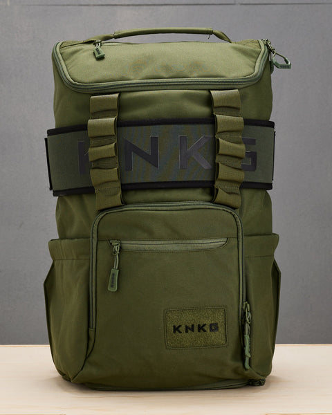 Green CORE Backpack with matching lifting belt wrapped around