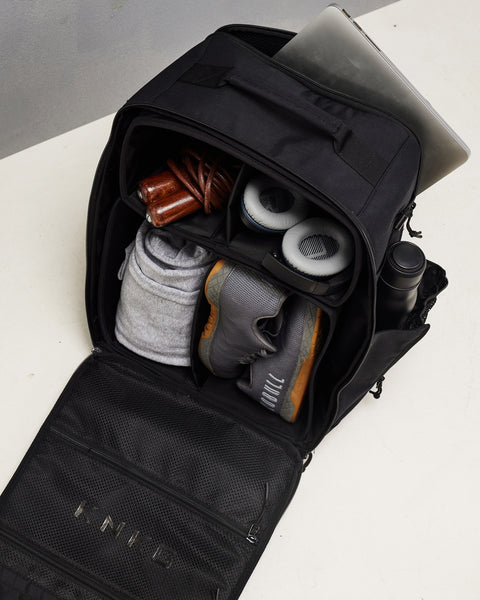Laptop sleeve and bottle pockets of large black CONQUER Backpack
