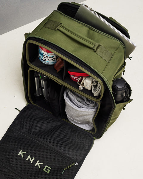 Laptop sleeve and internal dividers of  large green CONQUER Backpack