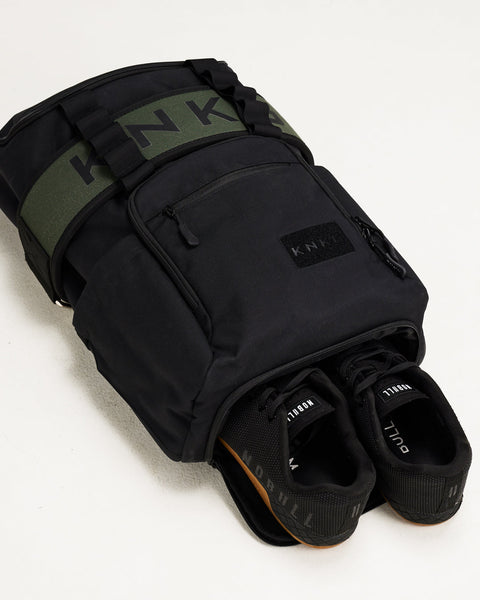 Sneakers inside black CORE Backpack shoe compartment