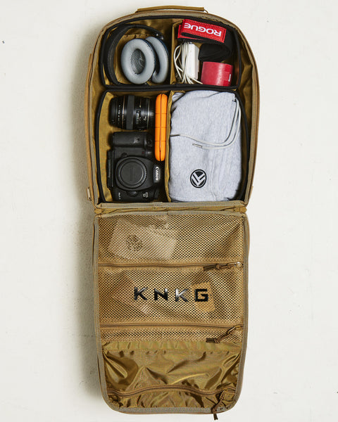 Birds eye view of Small desert KNKG CONQUER Backpack internal dividers packed and organized with gym gear