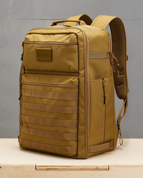 Side view of desert KNKG CONQUER Backpack