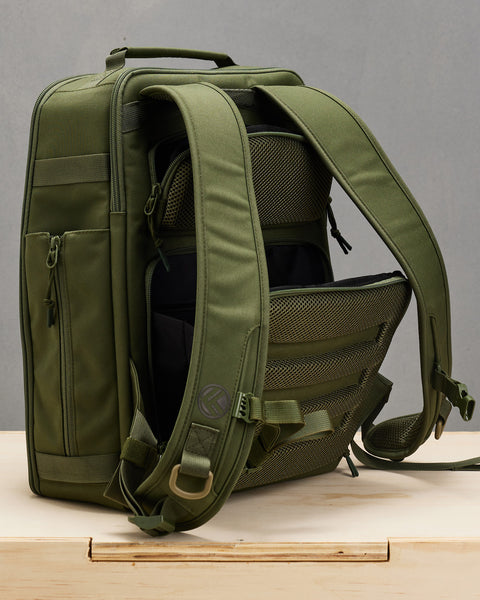 Back view of hidden concealed compartments of small green KNKG CONQUER Backpack