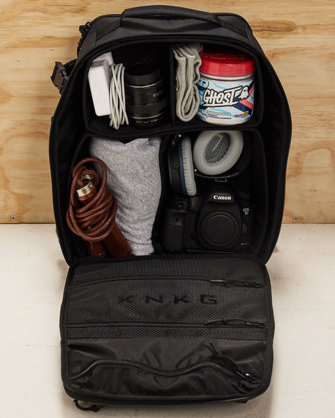 Internal view of neatly packed dividers of Small black KNKG CONQUER Backpack