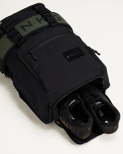 Sneakers inside large black CORE Backpack shoe compartment