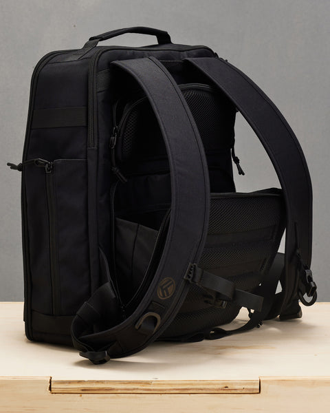 Back view of hidden concealed compartments of Small black KNKG CONQUER Backpack