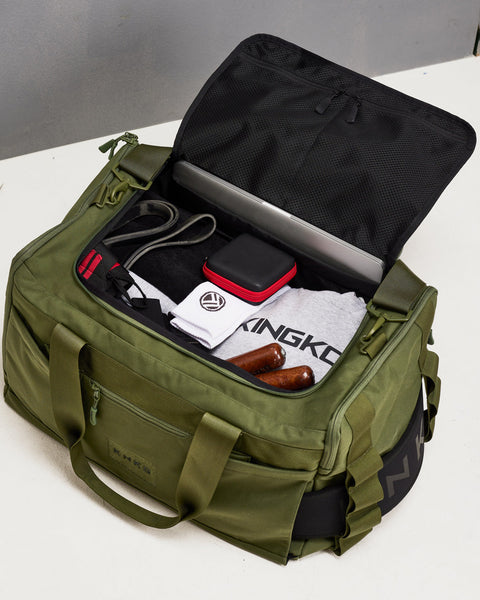 Birds eye view of large green CORE Duffel packed with gym gear