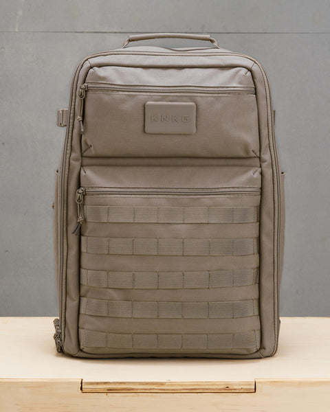 Front view of beige neutral large KNKG CONQUER Backpack