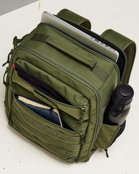 Packed pockets of small green KNKG CONQUER Backpack