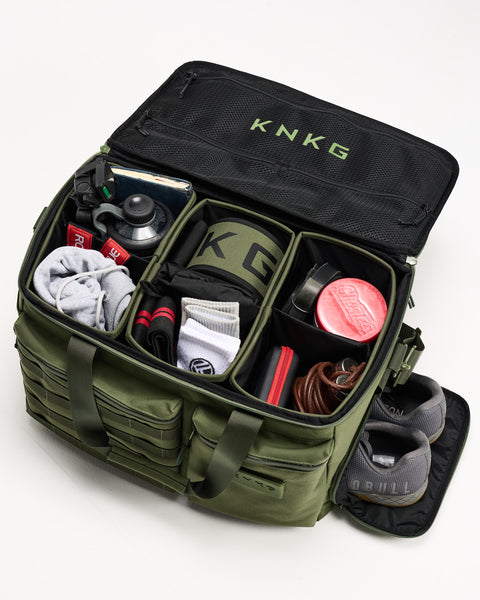 Green KNKG CONQUER Duffel internal dividers packed with gym essentials and shoes