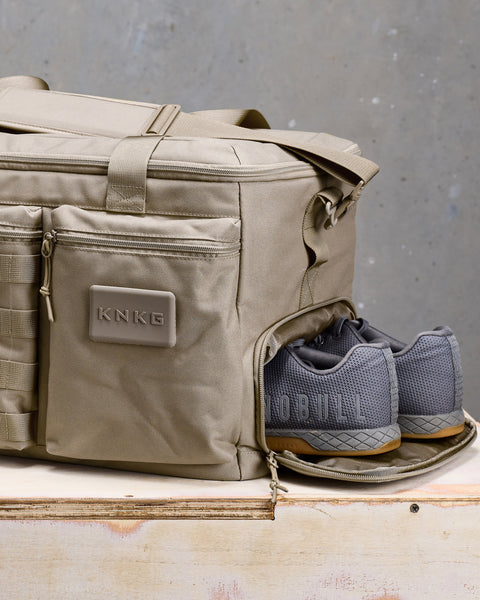 Close up of neutral beige KNKG CONQUER Duffel shoe compartment with sneakers