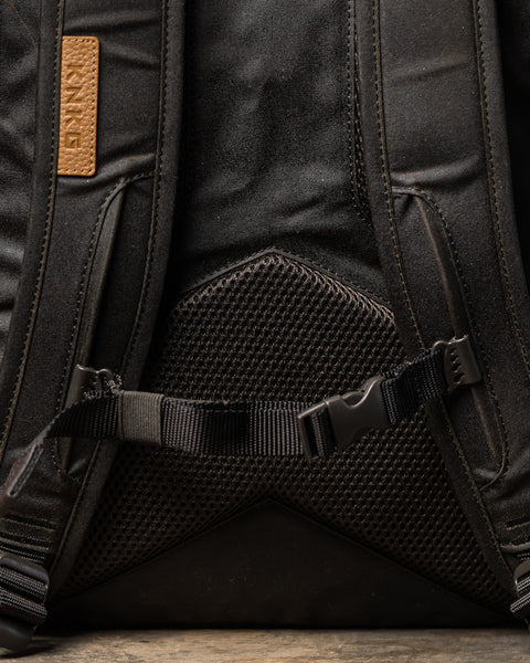 Close up of back panel of KNKG Waxed Canvas Backpack