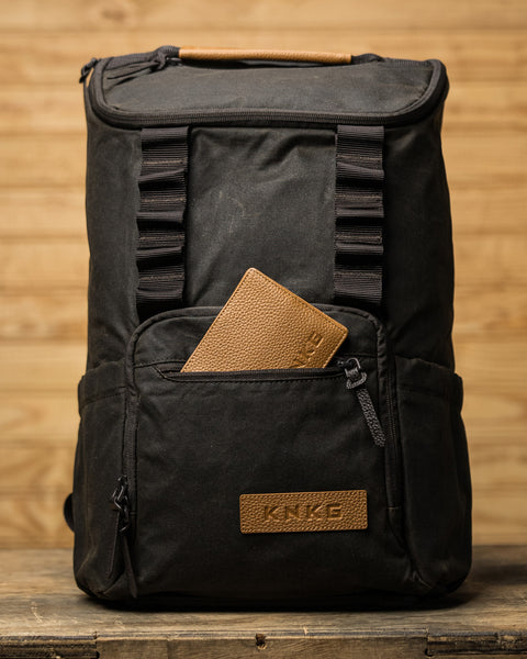 Leather wallet inside front pocket of KNKG Waxed Canvas Backpack