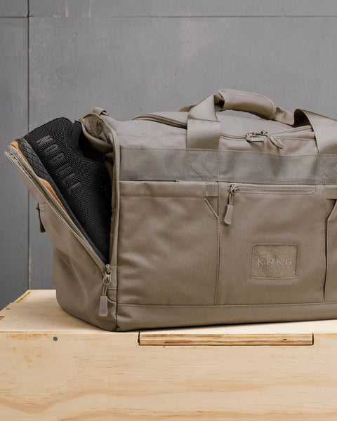 NOBULL sneakers inside large neutral beige CORE Duffel shoe compartment