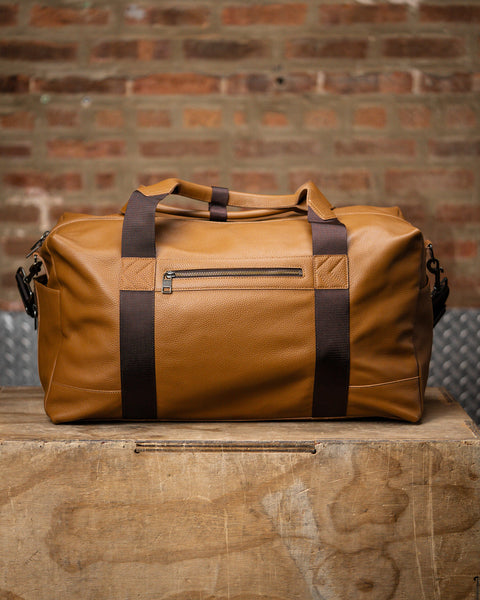 Back view of pocket on large tan HERITAGE leather duffel