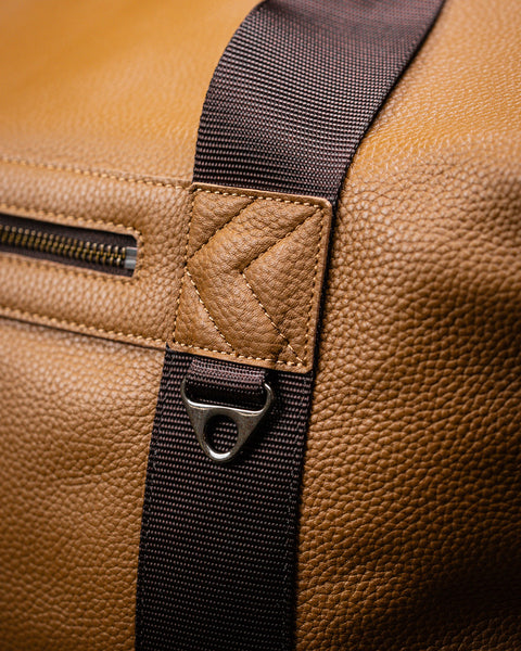 Close up of large tan HERITAGE duffel leather grain