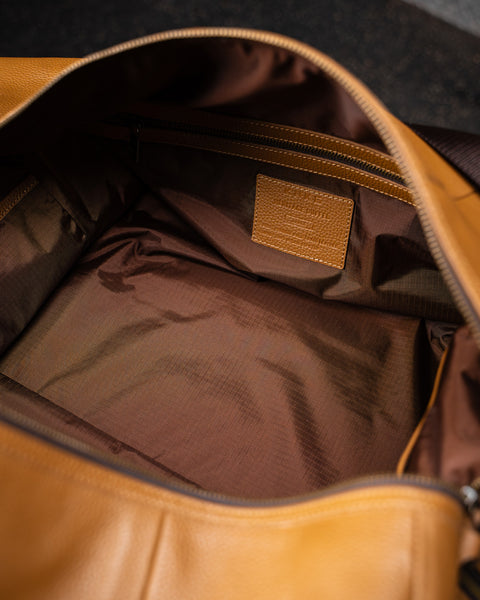 Close up of brown lining in large tan HERITAGE leather duffel
