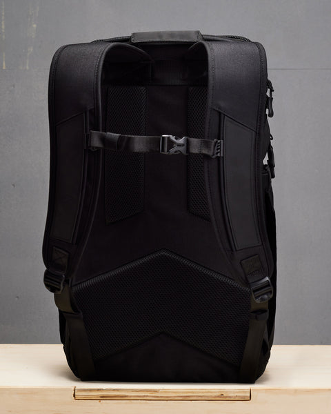 Back view of chest strap and padded shoulder straps of Black KNKG PLUS Backpack