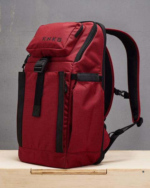 Side view of Red KNKG PLUS Backpack