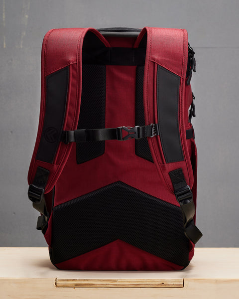 Back view of Red KNKG PLUS Backpack chest strap and padded shoulder straps