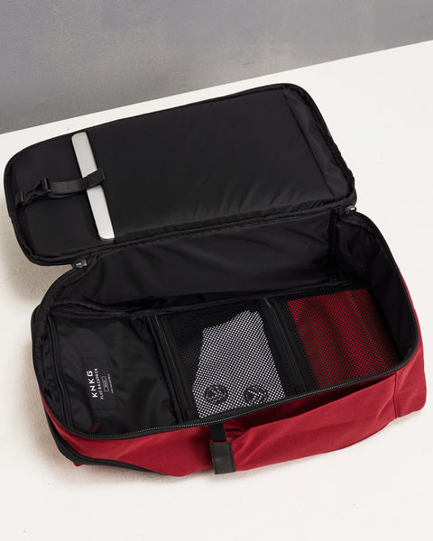 Internal view of clamshell flat pack opening of Red KNKG PLUS Backpack