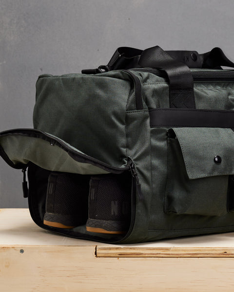 NOBULL sneakers inside charcoal grey KNKG PLUS duffel bag shoe compartment