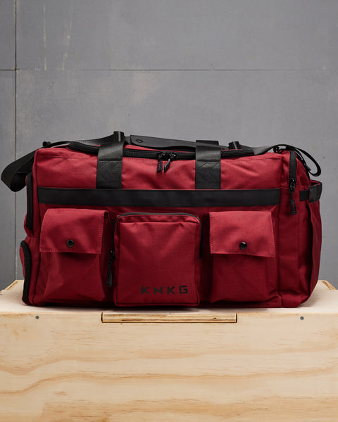 Front view of KNKG large red PLUS Duffel