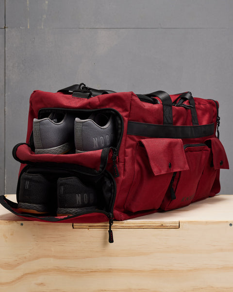 Two shoe compartments on KNKG large red PLUS Duffel