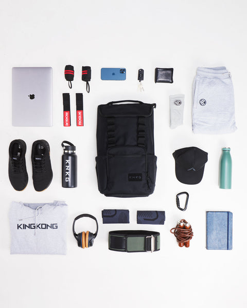 Flat lay of gym gear that packs inside CORE Backpack