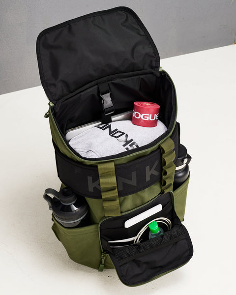 Green CORE Backpack pockets and internal packed with laptop, weight lifting belt, bottles and workout gear