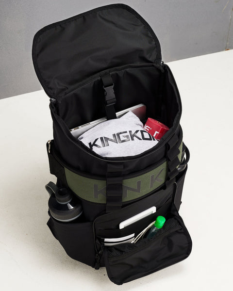 Internal of large black CORE Backpack pockets and compartments packed with bottles, laptop, hoodie and workout accessories