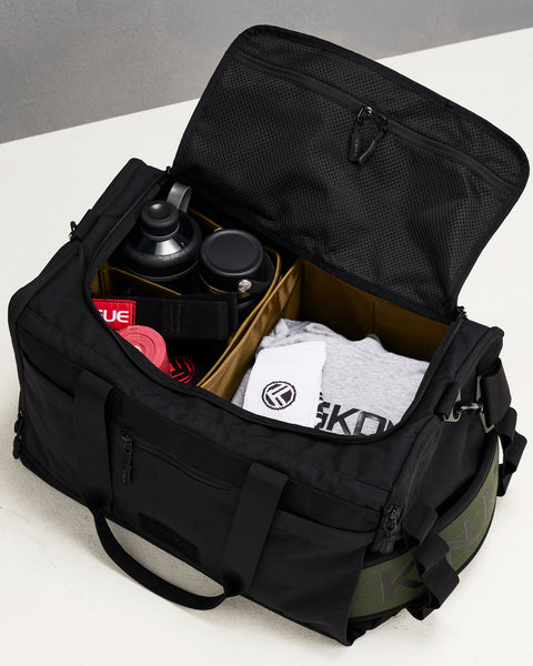 Divider organization system packed inside black CORE Duffel