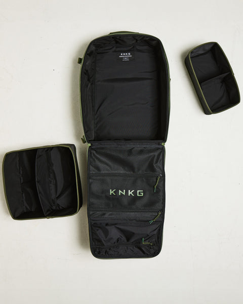 Flat lay of empty large green CONQUER Backpack
