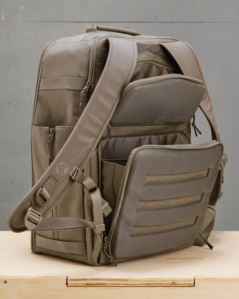 Back view of concealed compartments in beige neutral large KNKG CONQUER Backpack