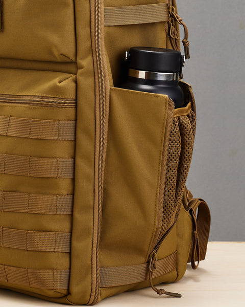 Drink bottle inside mesh side pocket of desert KNKG CONQUER Backpack