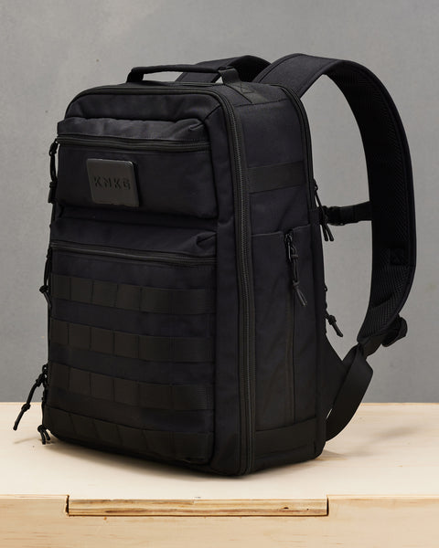 Side view of Small black KNKG CONQUER Backpack