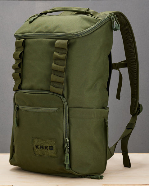 Side profile view of green CORE Backpack