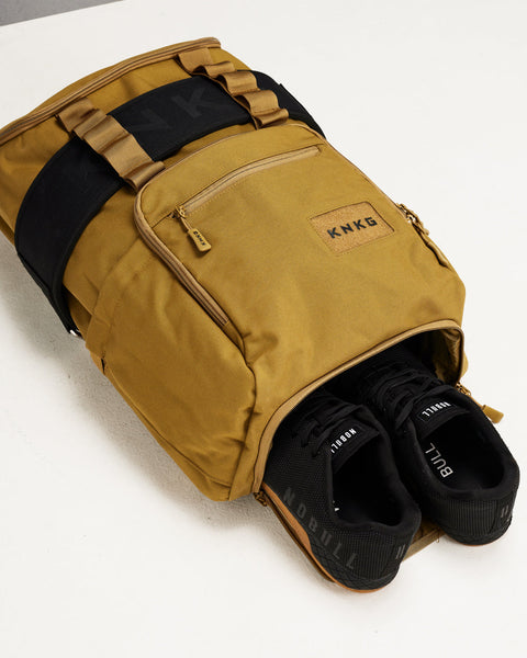 Sneakers inside large desert CORE Backpack shoe compartments