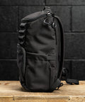 Side profile view of KNKG Mini CORE Backpack in Black