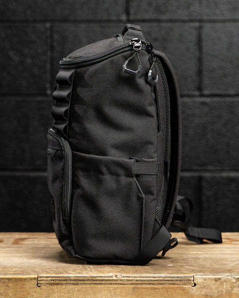 Side profile view of KNKG Mini CORE Backpack in Black