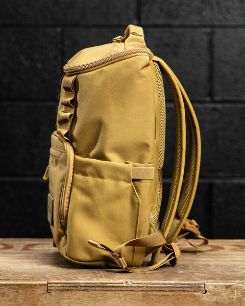 Side drink pocket view of KNKG CORE Mini Backpack in Tan Desert color