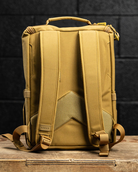 Back profile view of KNKG CORE Mini Backpack in Tan Desert color