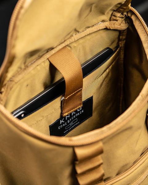 Close up of internal laptop sleeve in KNKG CORE Mini Backpack in Tan Desert color
