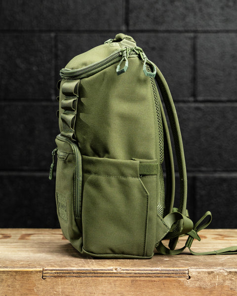 Side profile of green mini size KNKG CORE Backpack 