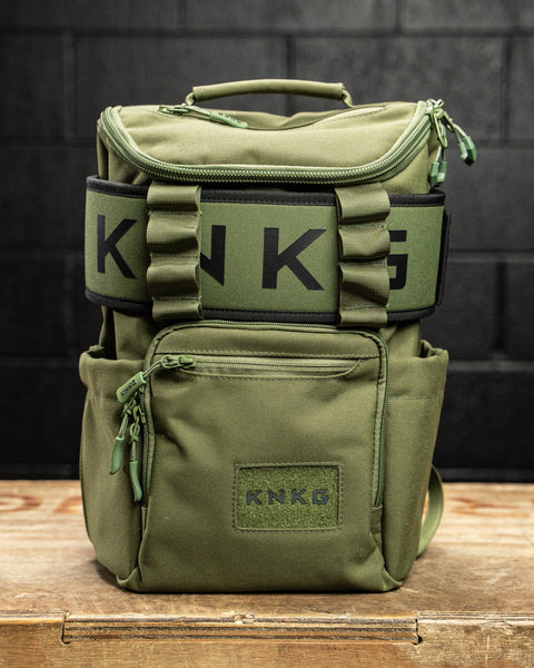 Front view of green mini size KNKG CORE Backpack with matching lifting belt