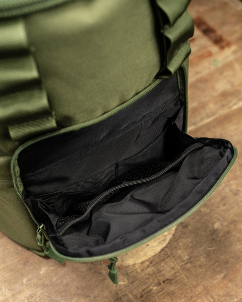 Close up of front pocket inside green mini size KNKG CORE Backpack 