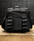 Close up of lifting belt inside sleeves of KNKG mini black CORE Duffel 