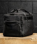 side pocket view of KNKG mini black CORE Duffel 