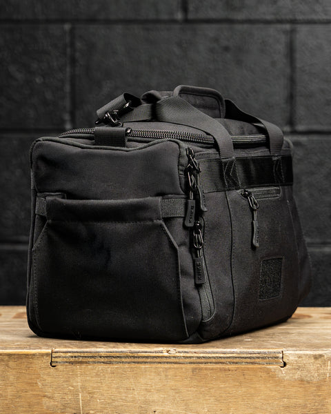side pocket view of KNKG mini black CORE Duffel 